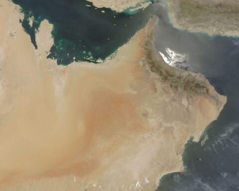 NASA MODIS satellite image showing the Persian Gulf, Strait of Hormuz, and Gulf of Oman — the contested waterway at the centre of the April 17 multilateral summit