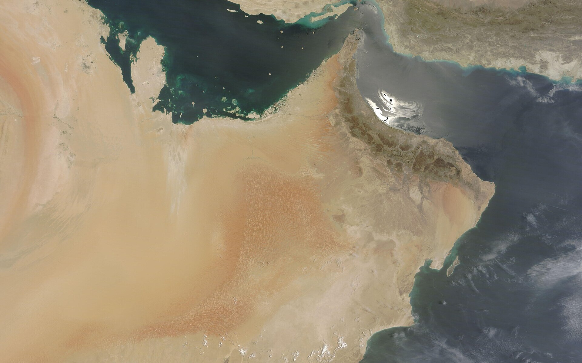 NASA MODIS satellite image showing the Persian Gulf, Strait of Hormuz, and Gulf of Oman — the contested waterway at the centre of the April 17 multilateral summit