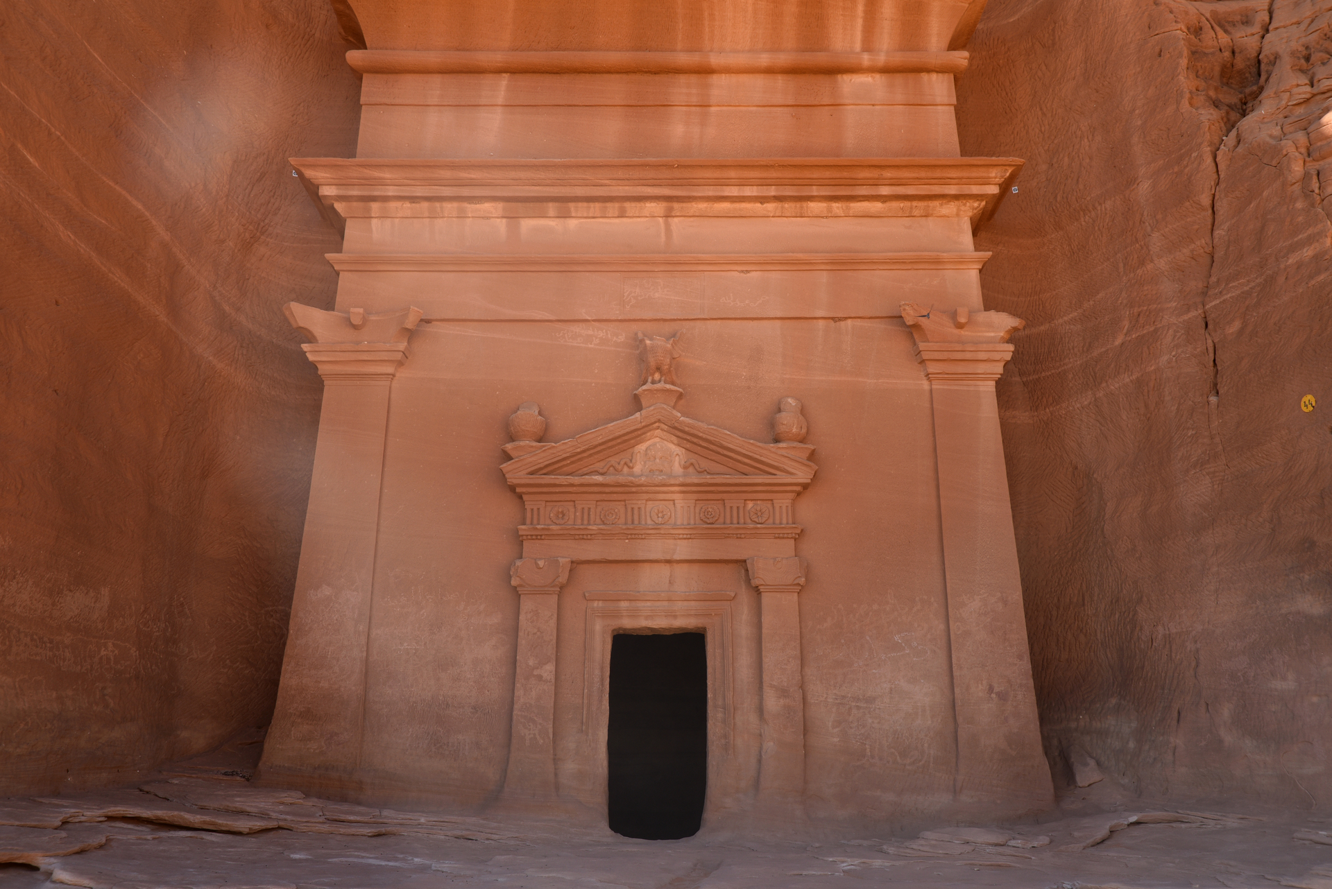Nabataean rock-cut tomb at Hegra near AlUla with elaborately carved sandstone facade