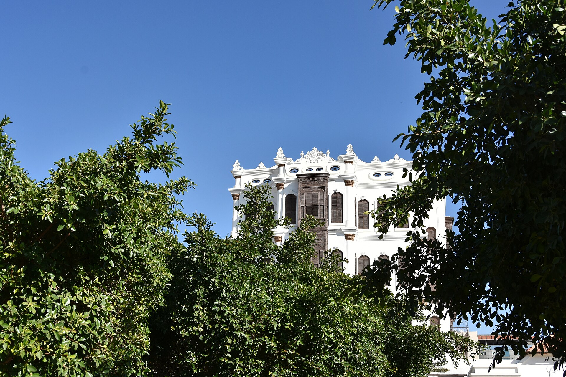 Shubra Palace in Taif, a white Ottoman-Hejazi style building surrounded by trees