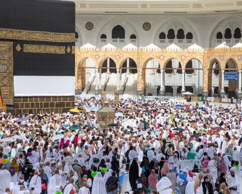 Pilgrims circumambulating the Kaaba at Masjid al-Haram in Mecca during the 2025 Hajj season, thousands of worshippers in white ihram garments
