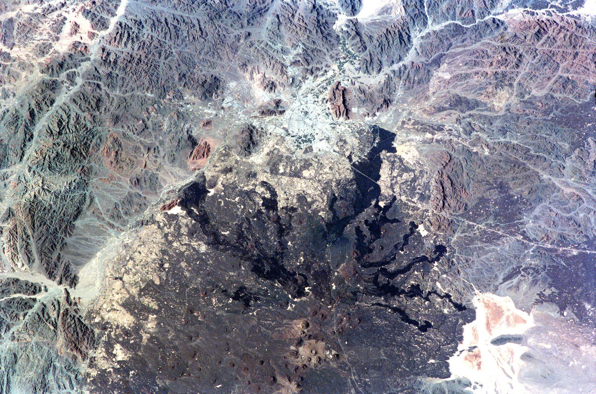 Space Shuttle view of Harrat Rahat lava field stretching south from Medina, Saudi Arabia