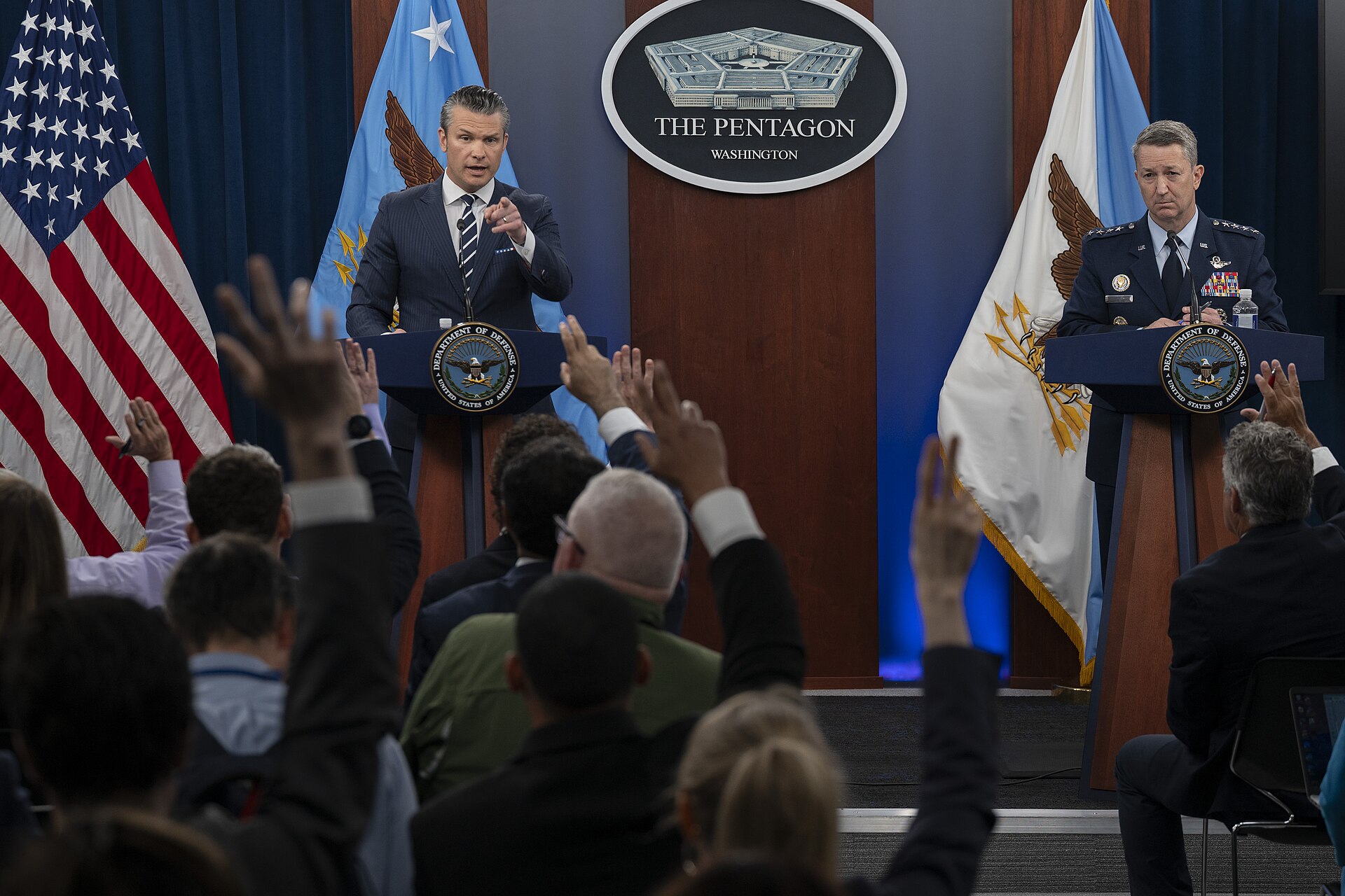 Secretary of Defense Pete Hegseth and CJCS Gen. Dan Caine at Pentagon press briefing podium with DoD seal, June 2025