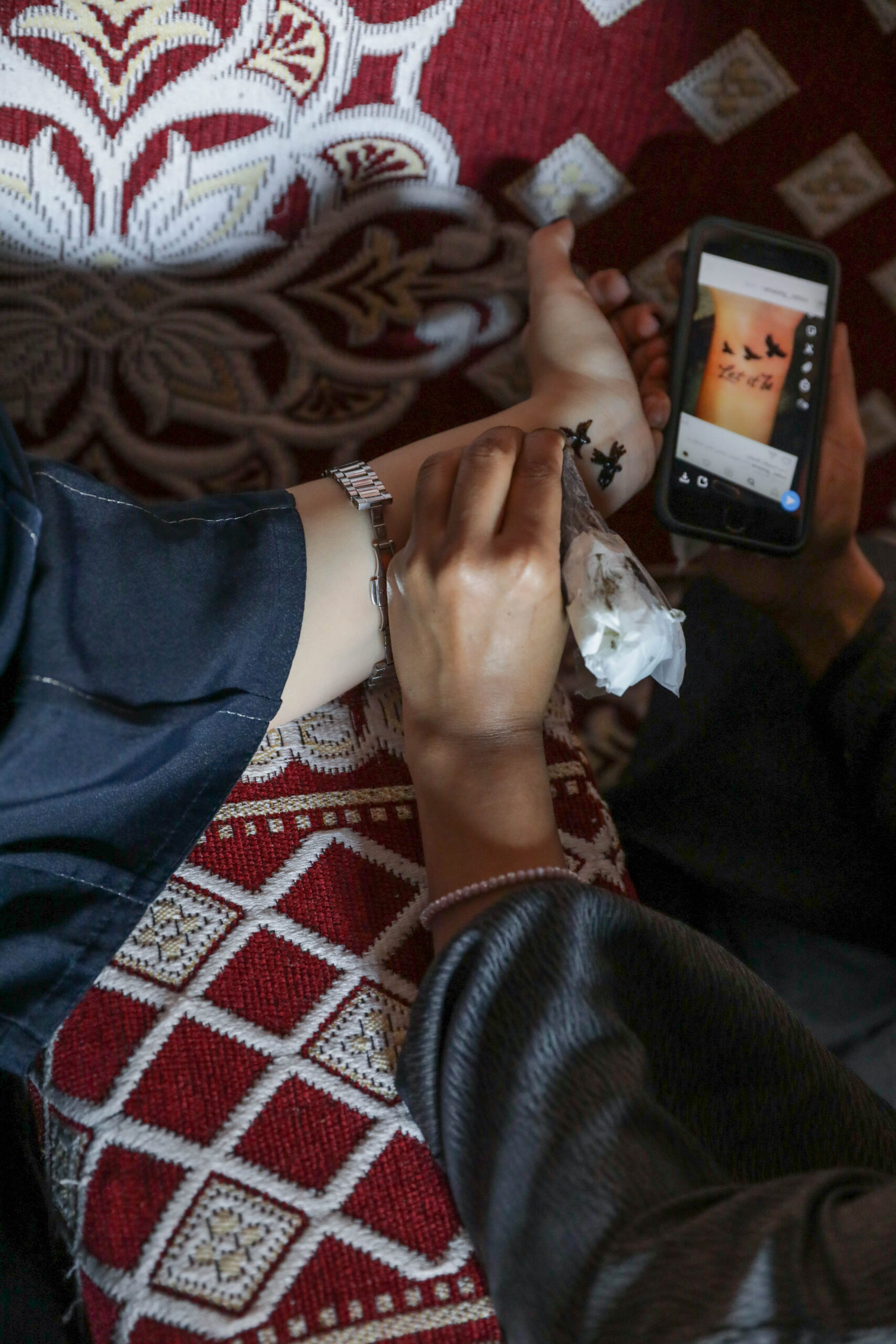 Close-up of henna being drawn on a hand in Saudi Arabia