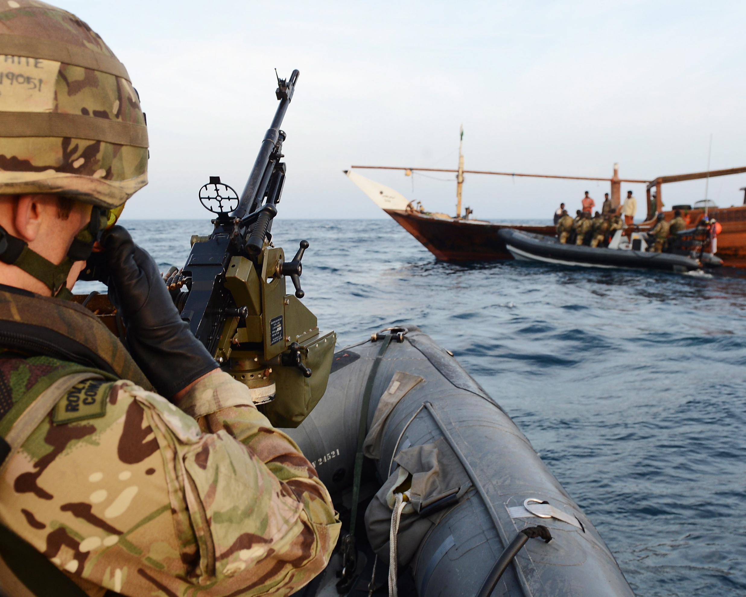 Royal Marines boarding team from HMS Monmouth Type 23 frigate approaches a dhow during maritime security operations in the Arabian Gulf