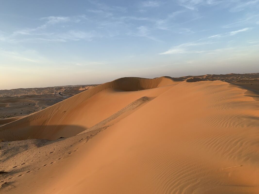 Golden sand dunes of the Rub al-Khali Empty Quarter in Saudi Arabia stretching to the horizon
