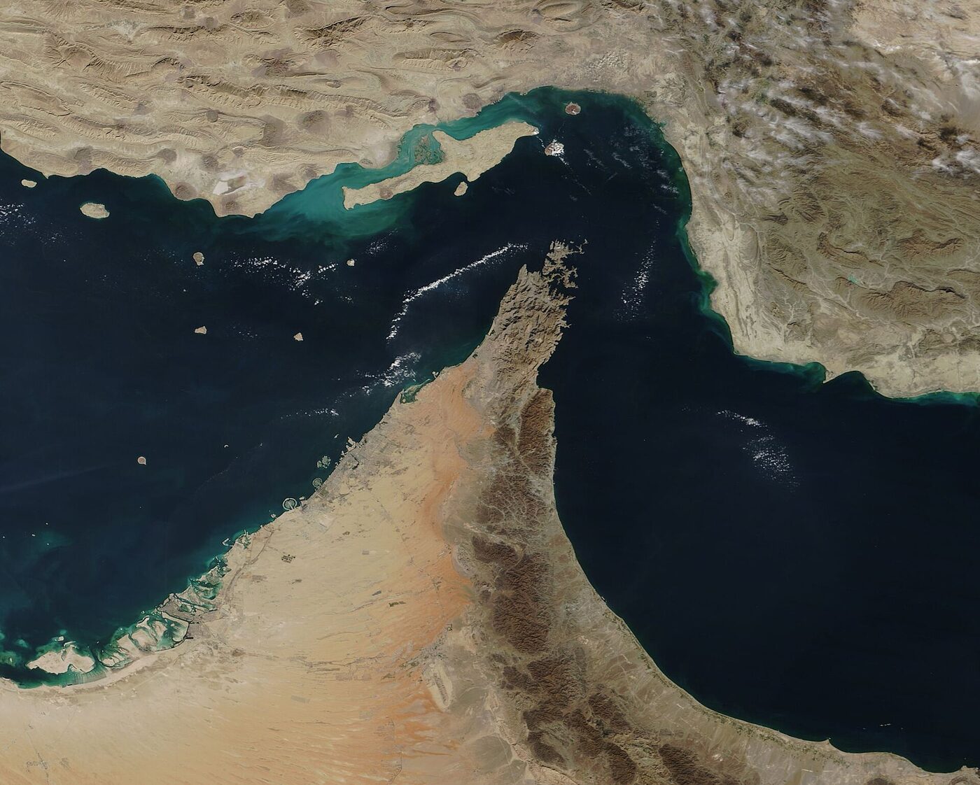 NASA MODIS satellite view of the Strait of Hormuz and Musandam Peninsula showing the narrow passage near Kumzar where IRGC gunboats fired on the CMA CGM Everglade