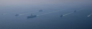 USS Abraham Lincoln carrier strike group sails in formation in the Arabian Sea, February 2026, as US forces positioned for operations against Iran