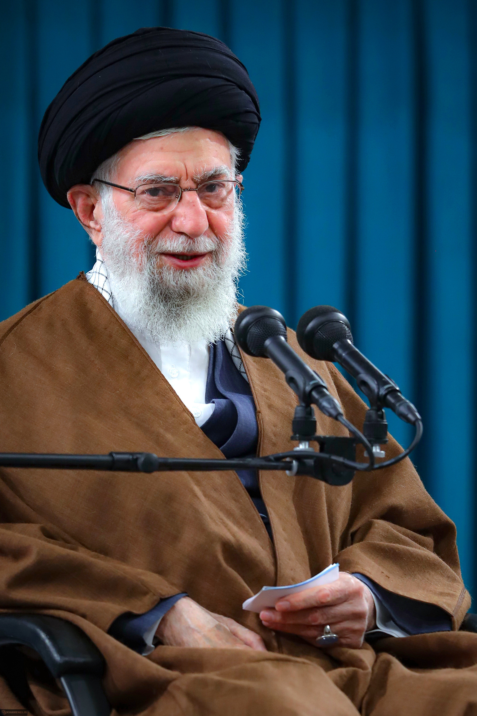 Iranian Supreme Leader Ali Khamenei speaking at a microphone, 2022