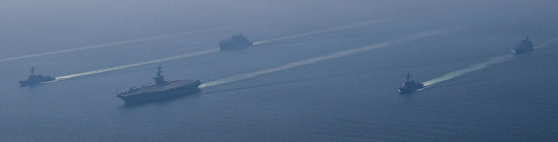 USS Abraham Lincoln carrier strike group, including destroyers USS Michael Murphy and USS Frank E. Petersen Jr., deployed to the Arabian Sea in February 2026 ahead of Trumps April 6 deadline