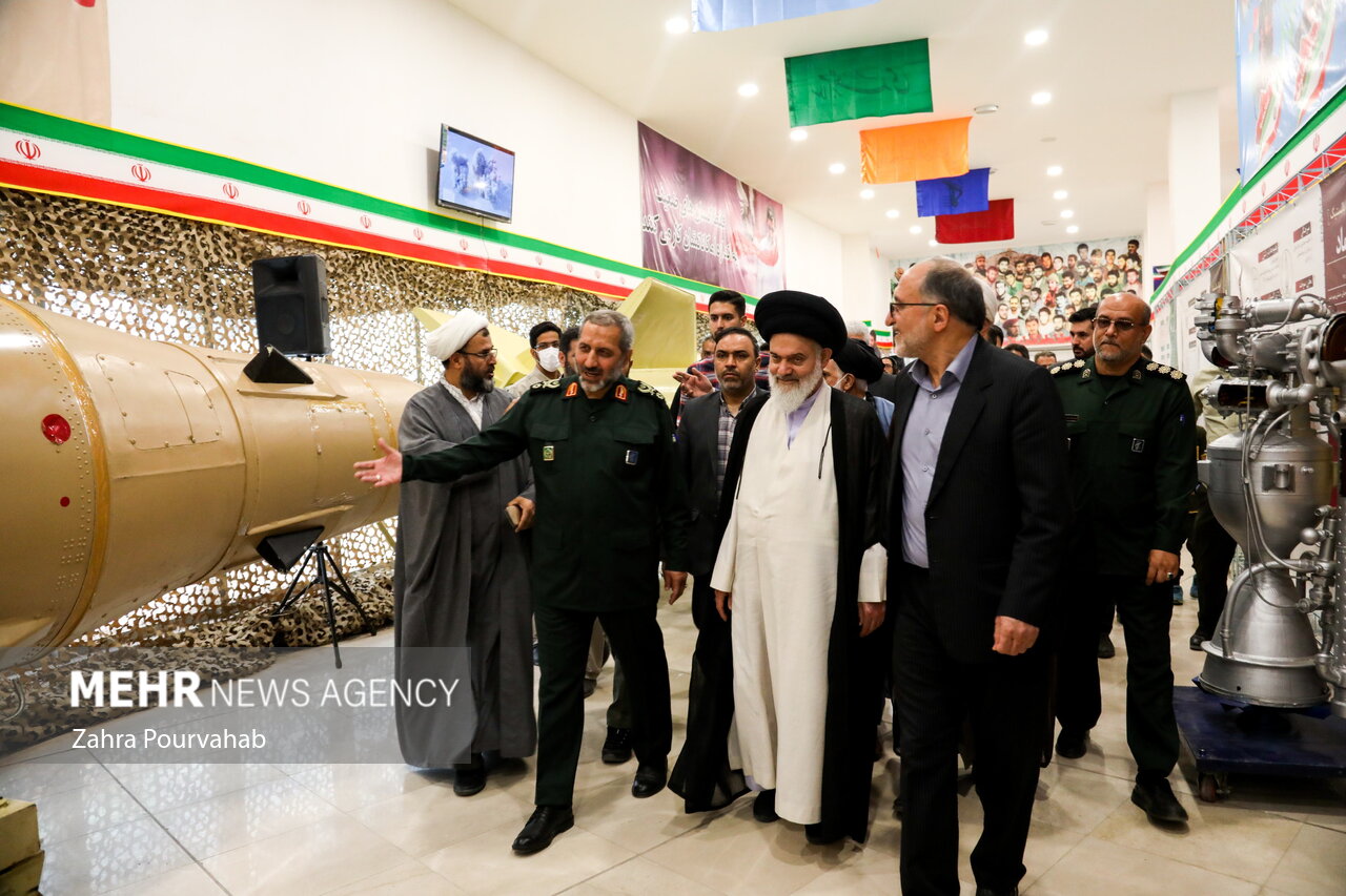 IRGC commanders tour missile hardware at the 2023 IRGC Aerospace Force achievements exhibition in Qom, illustrating the institutional scale of the Guards' independent weapons and command structure