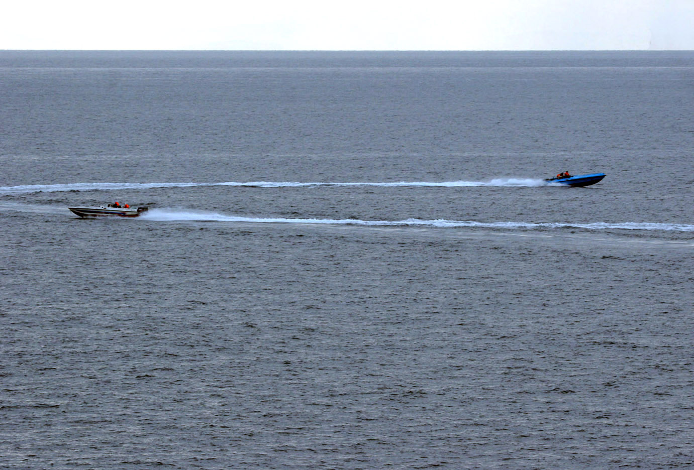IRGC fast attack speedboats maneuver at high speed in the Persian Gulf near USS Port Royal during a 2008 harassment incident