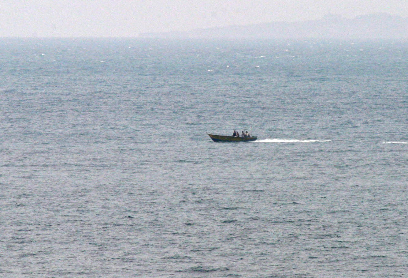 IRGCN small craft maneuvering aggressively near US Navy ships in the Strait of Hormuz, January 2008 — a pattern Ghalibaf cited when disclosing the minesweeper standoff during Islamabad ceasefire negotiations