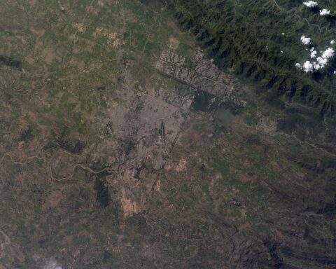 Islamabad, Pakistan photographed from the International Space Station, showing the city grid against the Margalla Hills. The city hosted the Iran-US ceasefire accord in April 2026.