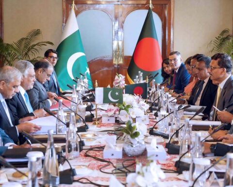 Pakistan Foreign Minister Ishaq Dar chairs a formal diplomatic delegation meeting, with Pakistan flag prominent, representing Islamabad quadrilateral ceasefire framework talks