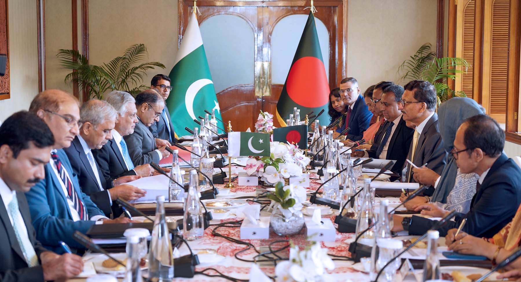 Pakistan Foreign Minister Ishaq Dar chairs a formal diplomatic delegation meeting, with Pakistan flag prominent, representing Islamabad quadrilateral ceasefire framework talks