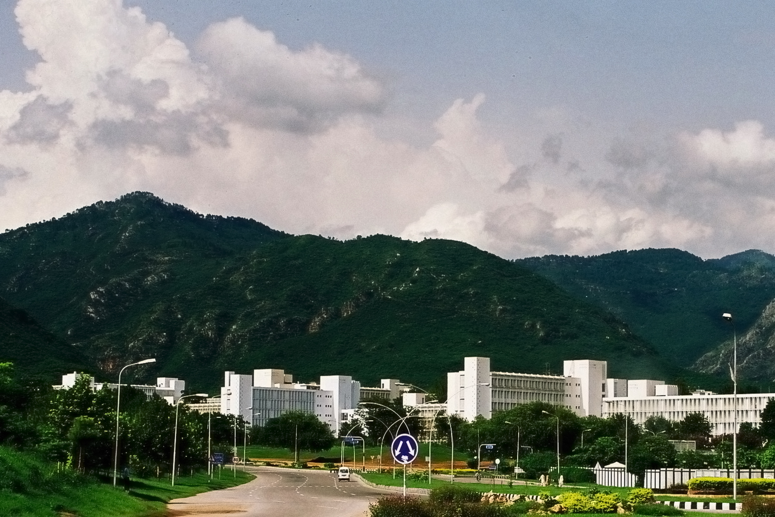 Pakistan Secretariat buildings in Islamabad with the Margalla Hills in the background. Pakistan hosts the April 2026 ceasefire talks between the United States and Iran, with its government district serving as the diplomatic venue.