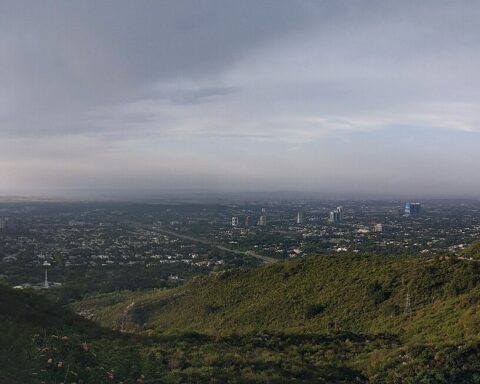 Islamabad city panorama from Margalla Hills showing government district with Faisal Mosque visible at right