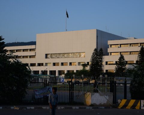 Pakistan Parliament House building in Islamabad at dusk, where Iran FM Araghchi arrived at Nur Khan airbase for Round 3 Iran-US talks mediated by Pakistan