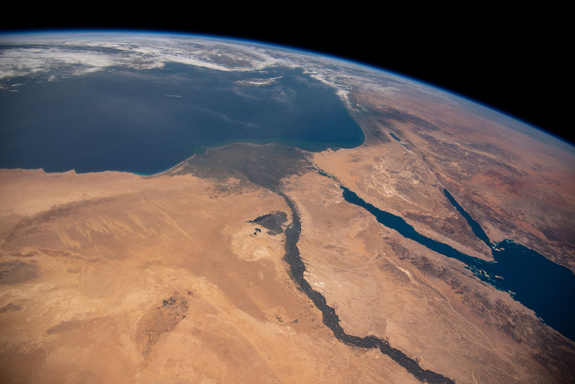 ISS-64 astronaut photograph showing the Nile River, Red Sea, Gulf of Aqaba, and Gulf of Oman from 263 miles above Earth. The Red Sea corridor carries approximately 5 million barrels per day of Saudi crude exports rerouted from Hormuz.