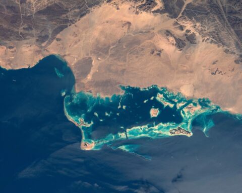 The northwestern coast of Saudi Arabia on the Red Sea, photographed from the International Space Station during Expedition 66. Yanbu al-Bahr — Saudi Arabia's primary Red Sea export terminal — lies on this coastline and handles the entirety of the kingdom's oil exports while Hormuz-facing terminals remain inaccessible. Photo: NASA / Public Domain