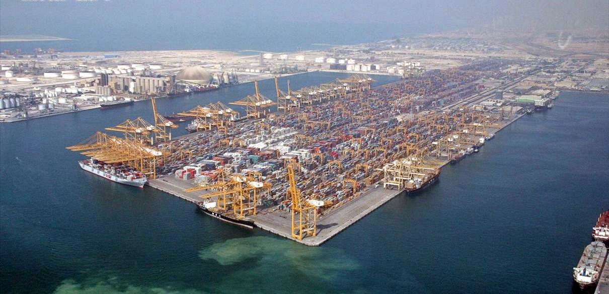 Aerial view of Jebel Ali port in Dubai, UAE, showing container terminal cranes and cargo ships — Middle East largest port