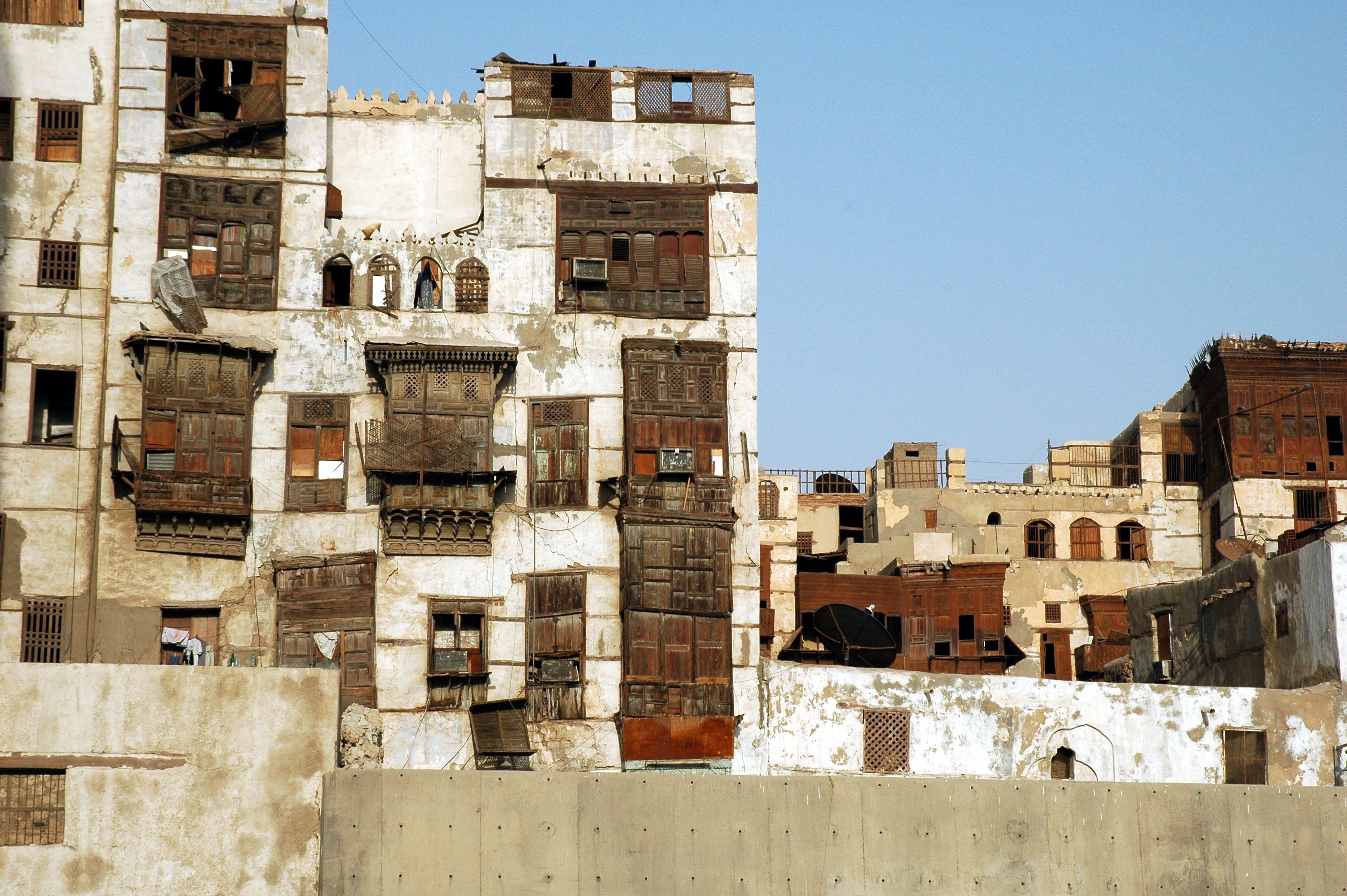Historic coral-stone buildings with wooden mashrabiya screens in Jeddah's Al-Balad district