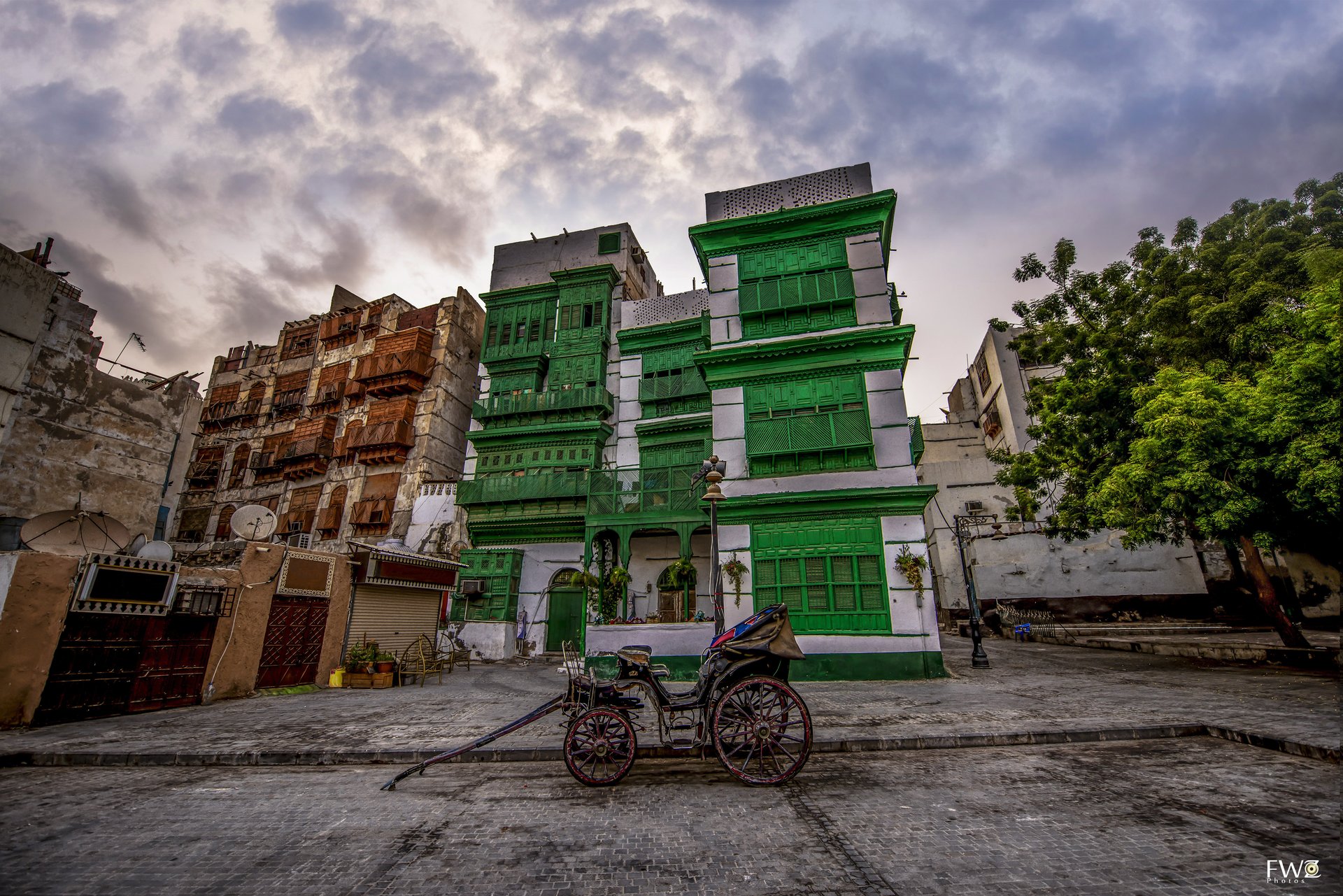 Colourful historic buildings with traditional rawasheen balconies in Al-Balad, Jeddah