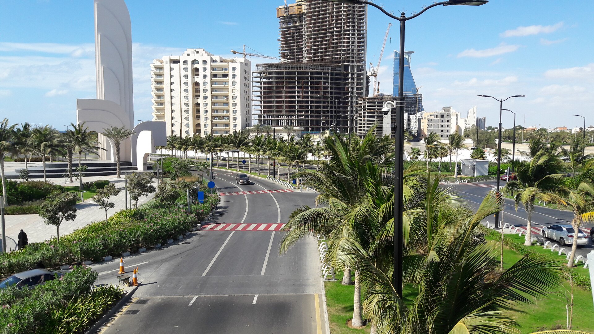 Palm-lined boulevard near Al Rowdah in Jeddah with modern architecture