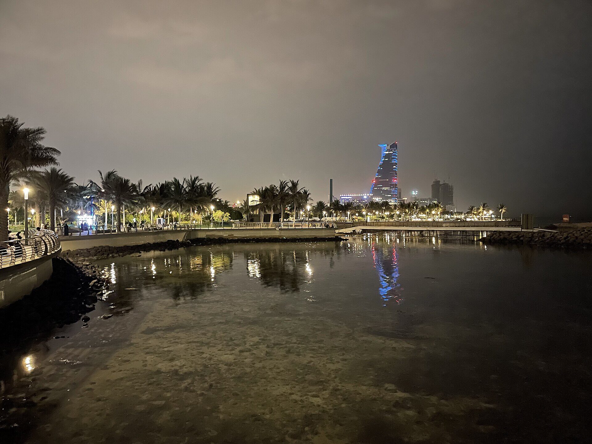 Jeddah Corniche waterfront at night with city lights reflecting on the Red Sea
