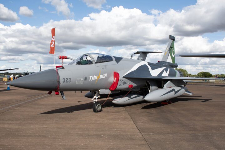 Pakistan Air Force JF-17 Thunder Block III multirole fighter jet on tarmac showing Pakistan crescent flag on tail fin