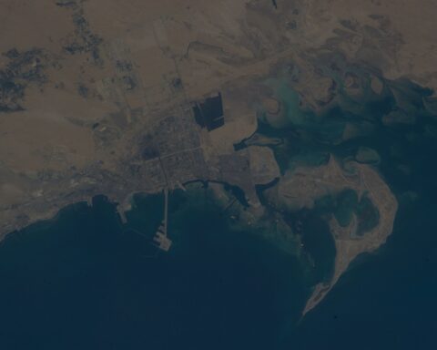 Jubail Industrial City II and surrounding Eastern Province coastline photographed from the International Space Station, showing the industrial port complex that feeds naphtha to Sadara Chemical Company — now shut due to Hormuz closure