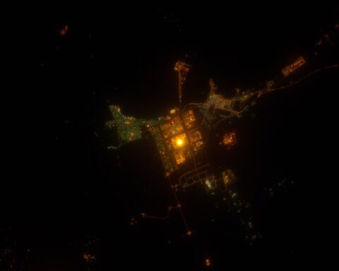 Jubail Industrial City at night from the International Space Station, showing the illuminated grid of the industrial zone on the Persian Gulf coast of Saudi Arabia