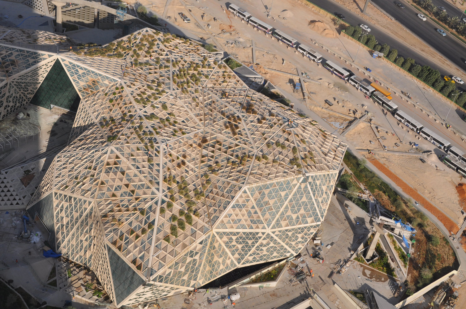 Aerial view of KAFD Conference Center under construction in Riyadh, a PIF-funded megaproject built over desert terrain