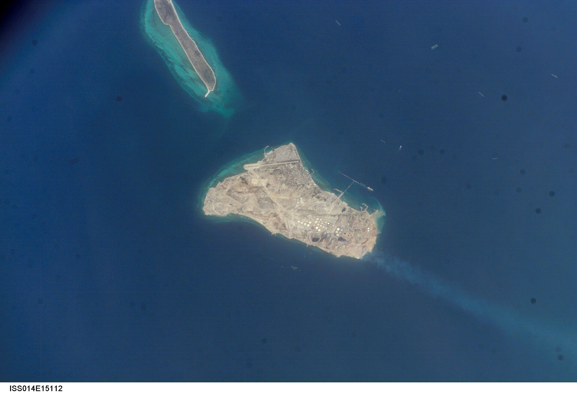 Kharg Island, Iran, photographed from the International Space Station during Expedition 14, showing oil storage tanks and loading piers
