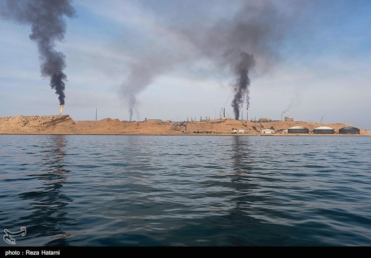Kharg Island oil export terminal with gas flares burning over the Persian Gulf, Iran