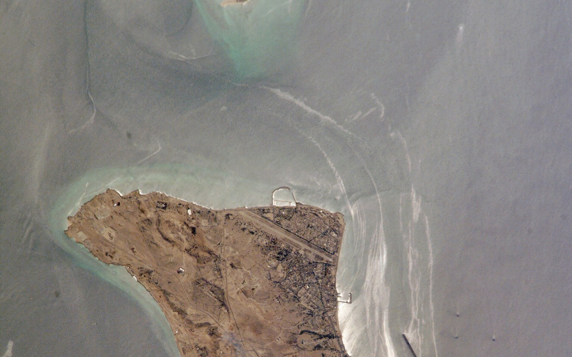 Kharg Island, Iran primary oil export terminal in the Persian Gulf, photographed from the International Space Station. NASA public domain.