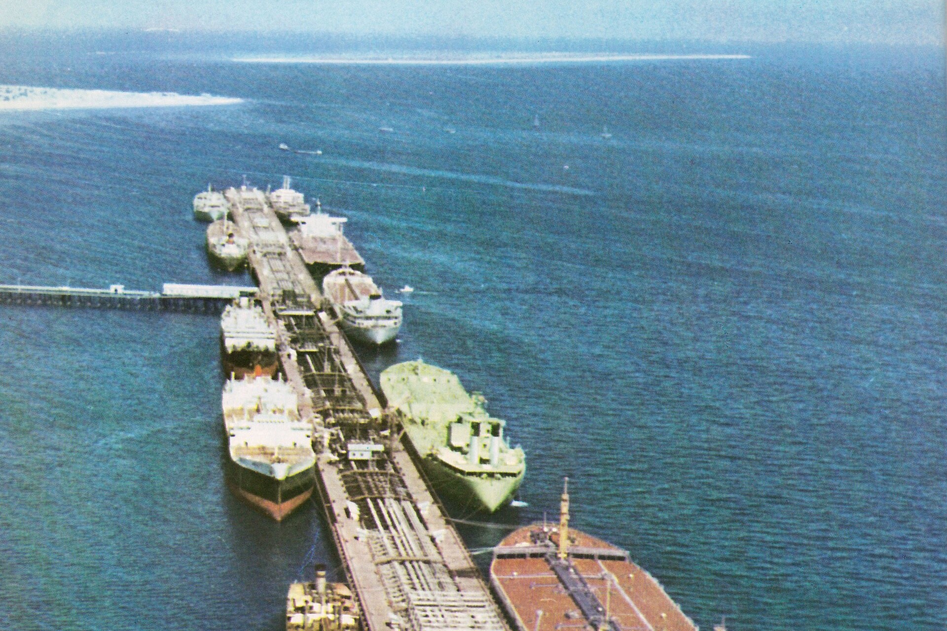 Large tankers loading crude oil at Kharg Island terminal, Iran primary Persian Gulf export facility. Public domain.