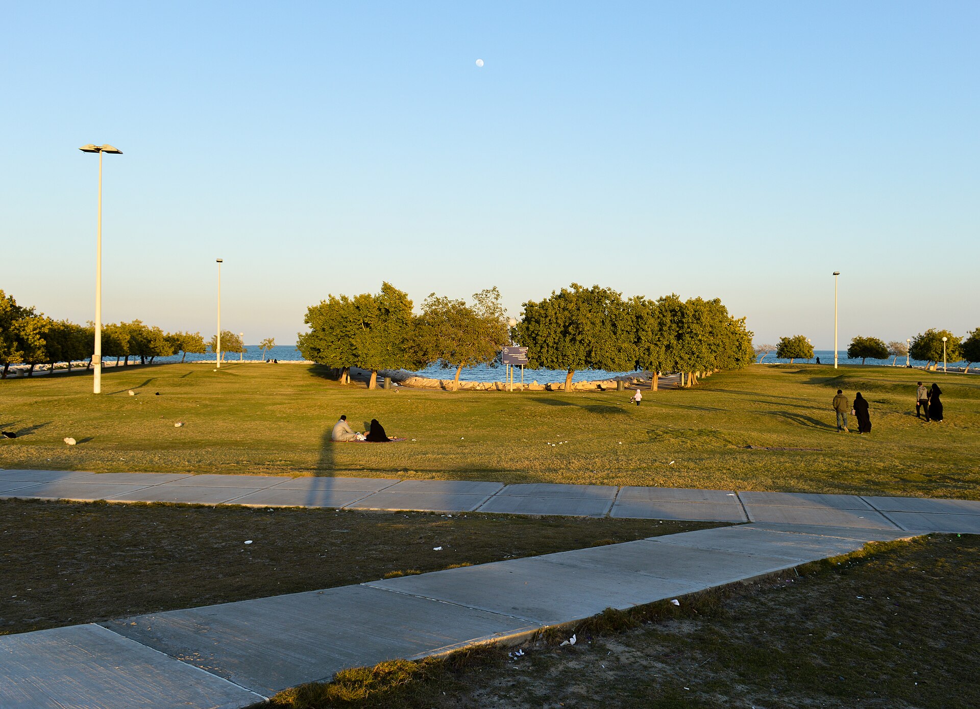 Al Khobar Corniche at dusk with Arabian Gulf and walking paths