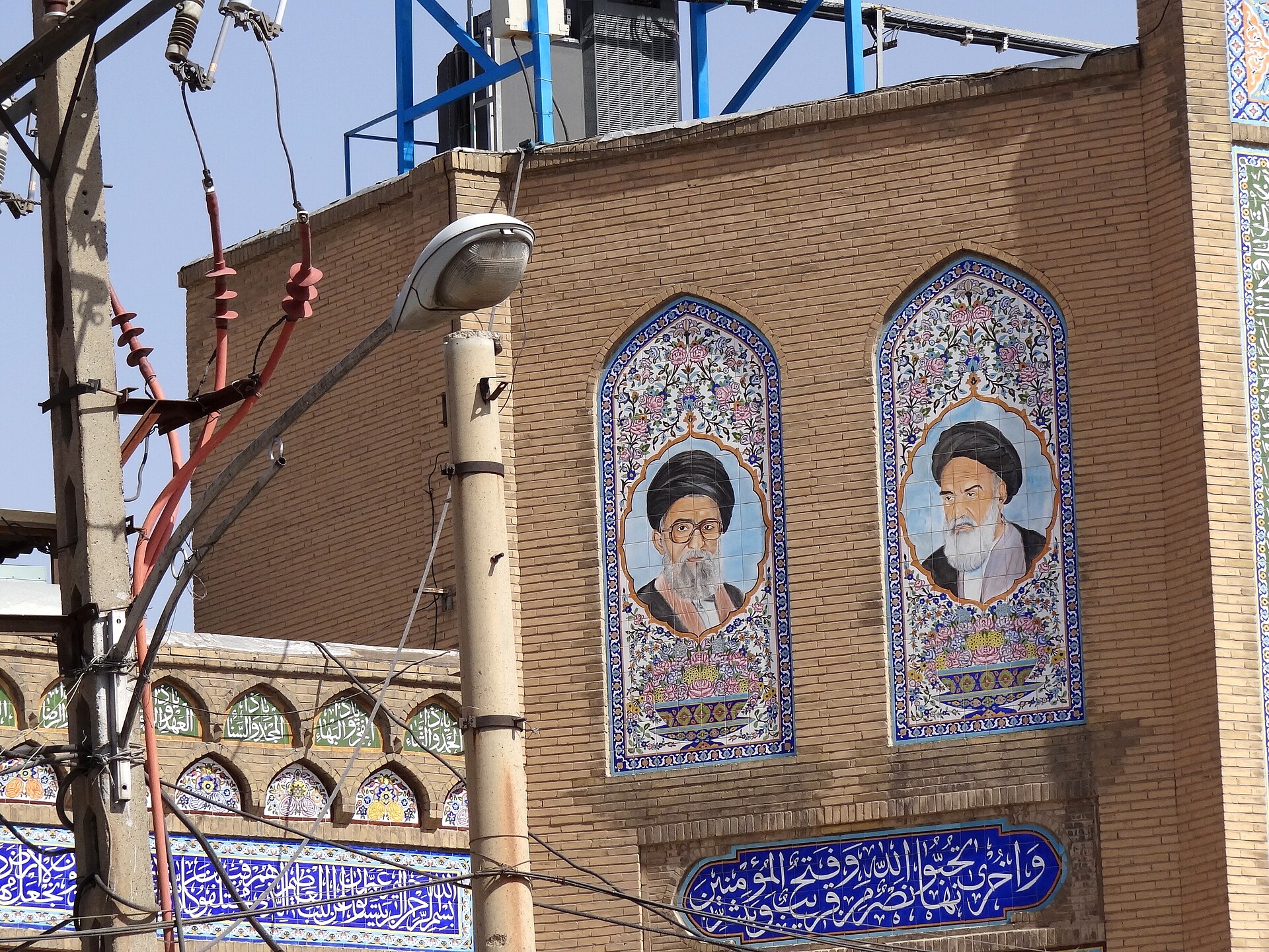 Tiled portrait mosaic of Ayatollahs Khomeini and Khamenei on mosque facade in Kermanshah, western Iran
