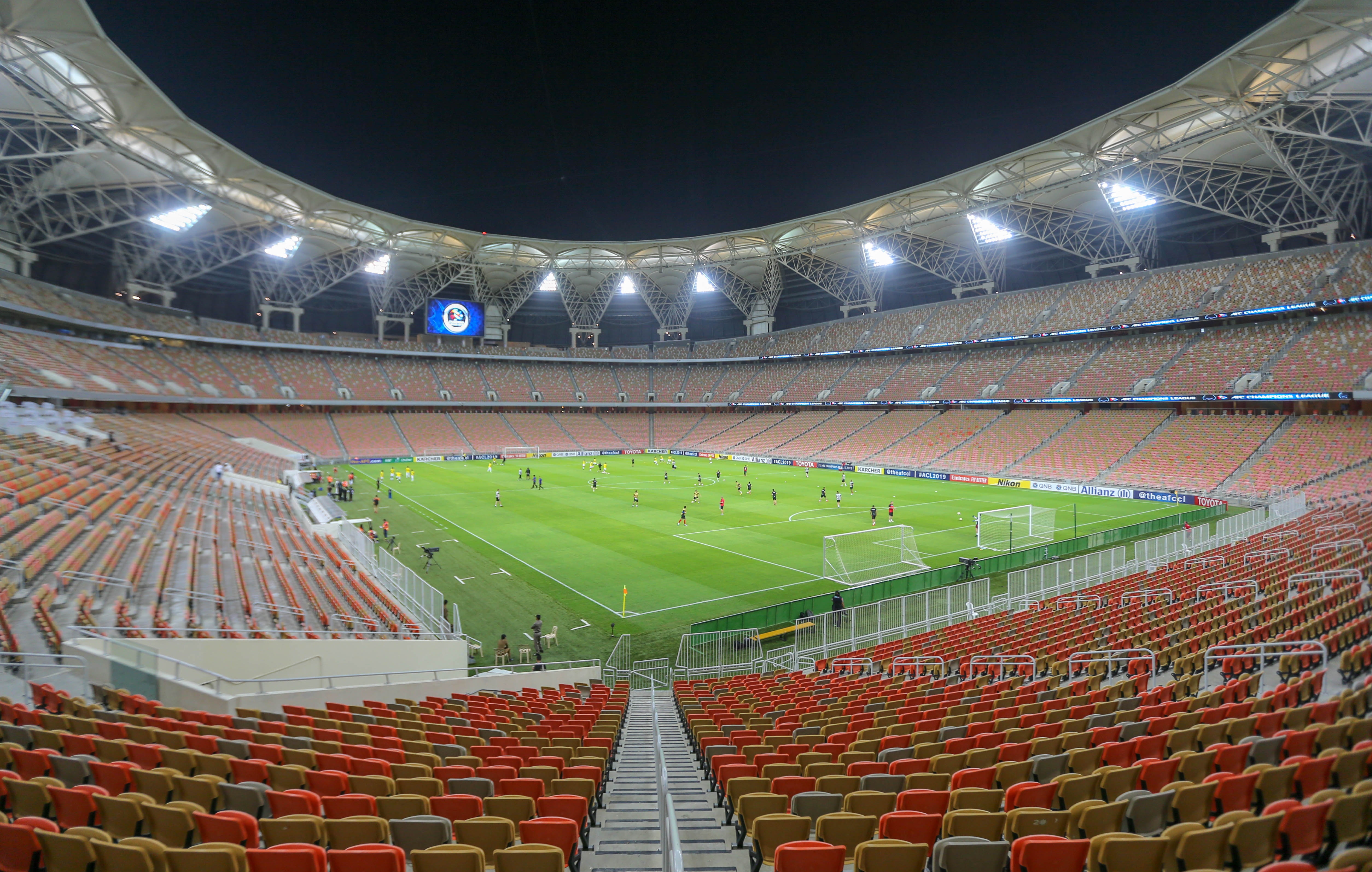 Interior view of King Abdullah Sports City stadium in Jeddah showing the retractable roof and seating