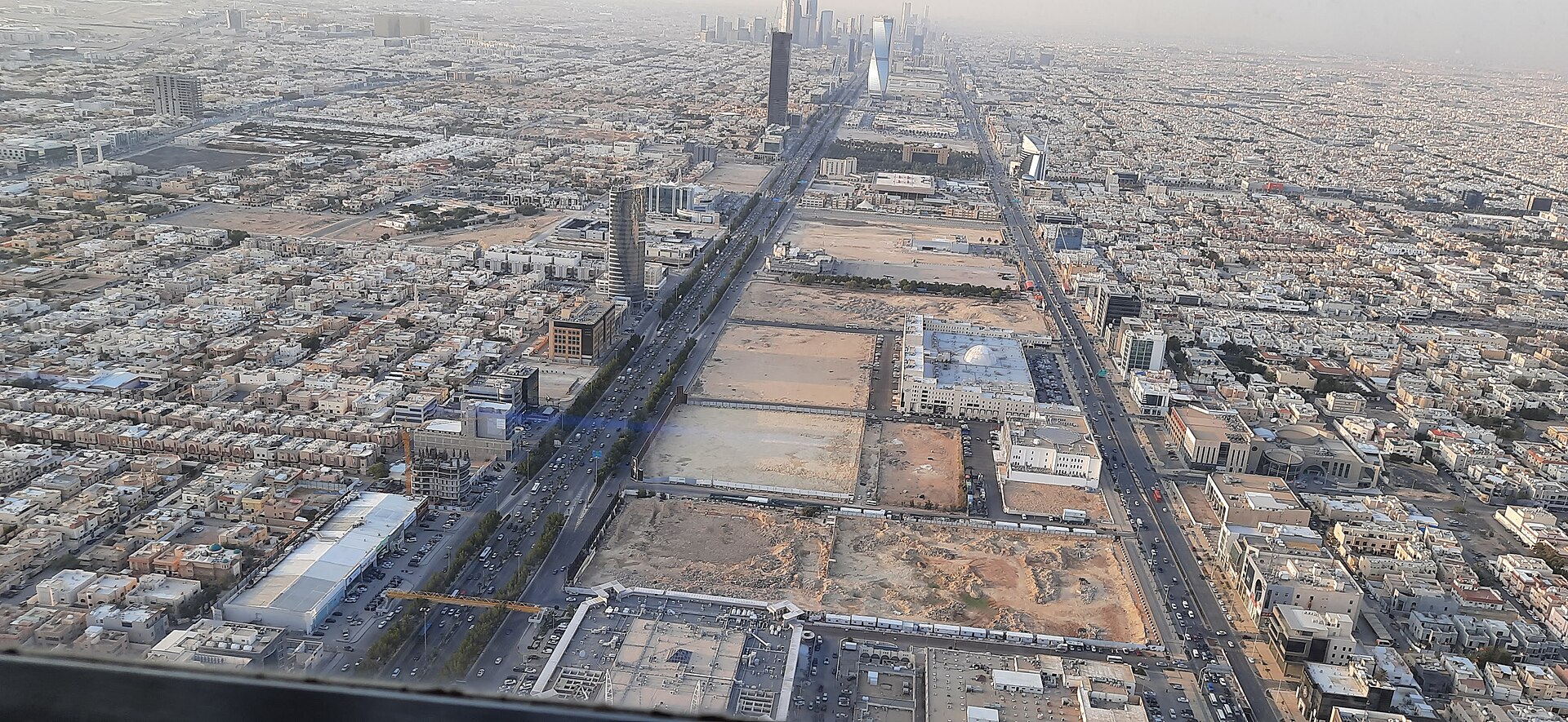 Panoramic aerial view of Riyadh looking south from the Kingdom Centre Sky Bridge, showing the urban sprawl stretching to the horizon