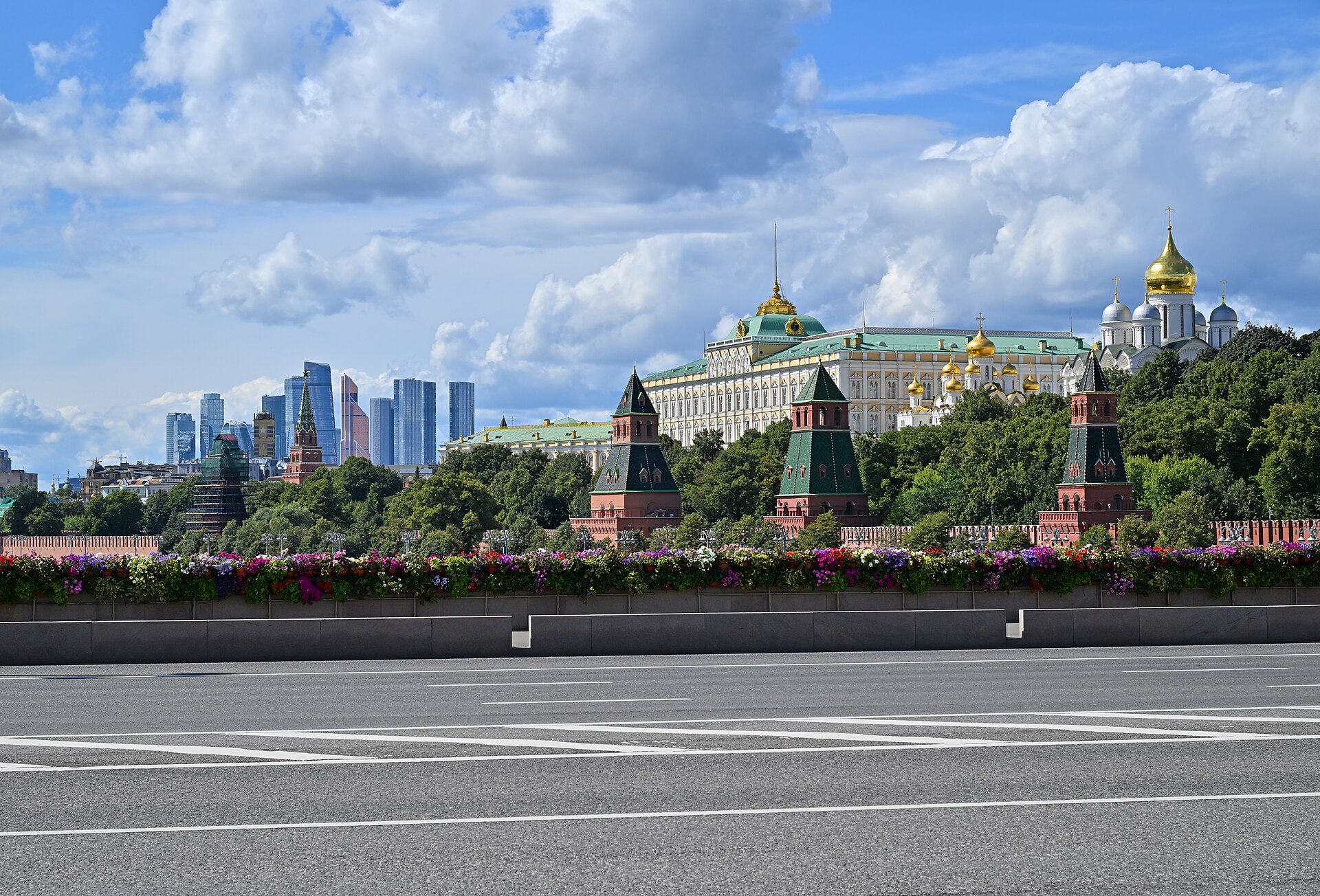 Moscow Kremlin skyline viewed from Bolshoy Moskvoretsky Bridge, showing Grand Kremlin Palace and gold-domed cathedrals, 2025