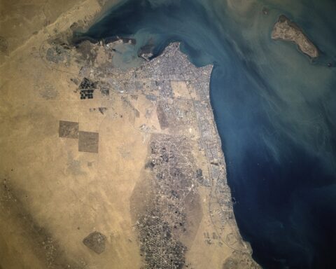 Aerial satellite view of Kuwait City and Al Burqan oil field on the Persian Gulf, showing Gulf energy infrastructure from space