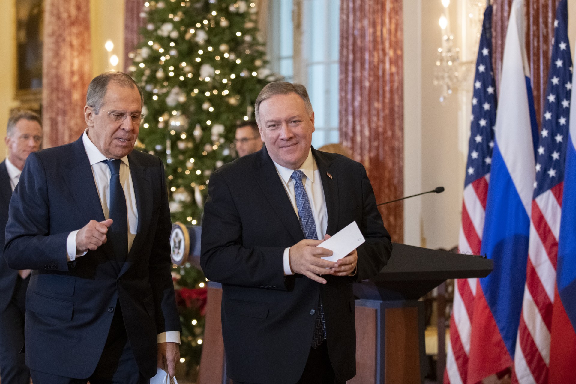 Russian Foreign Minister Sergei Lavrov at bilateral meeting with US Secretary of State, showing Russian and American flags