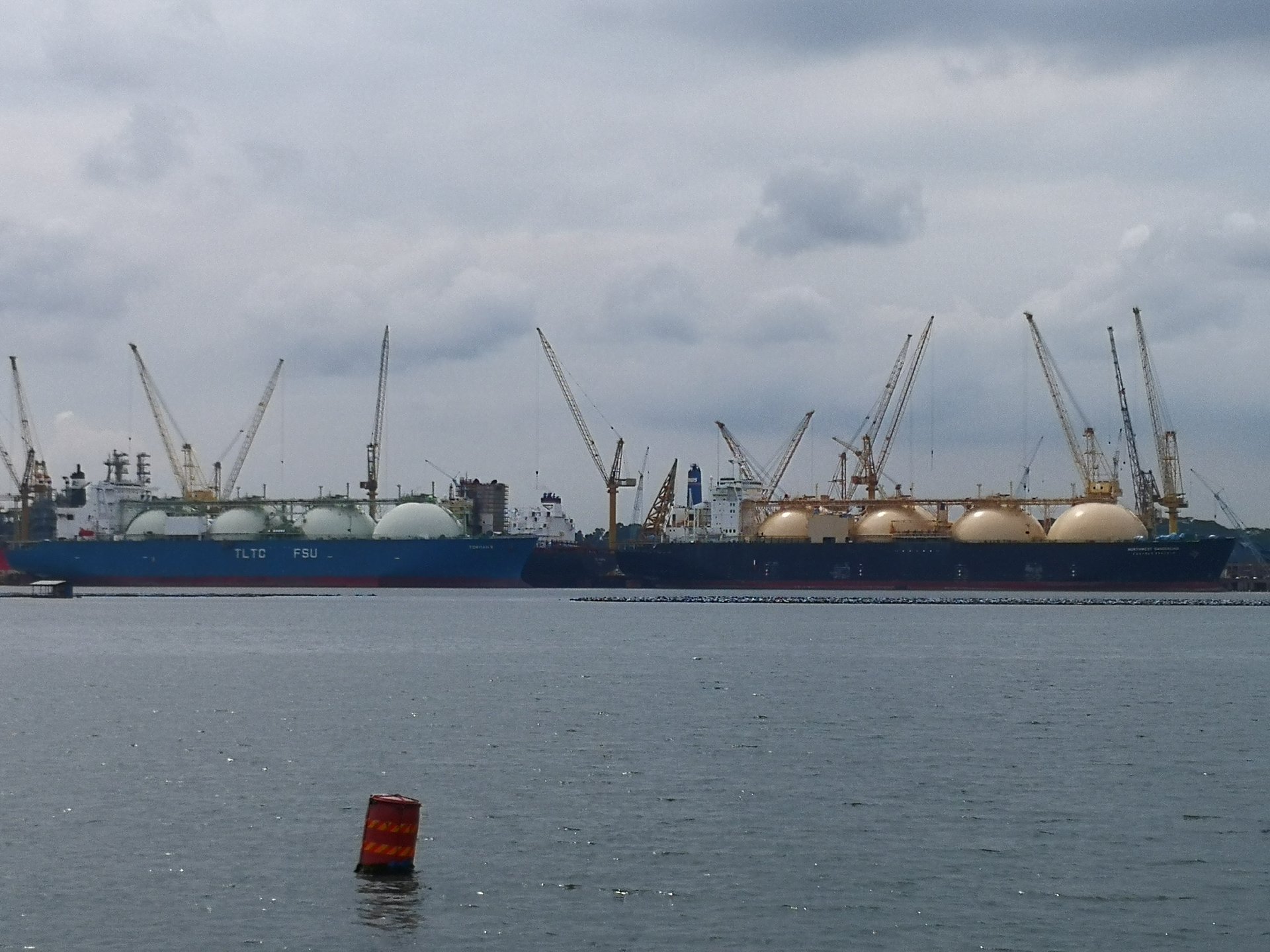 LNG carriers berthed at Sembawang, Singapore — a transit hub for Asian energy imports critically dependent on Hormuz passage