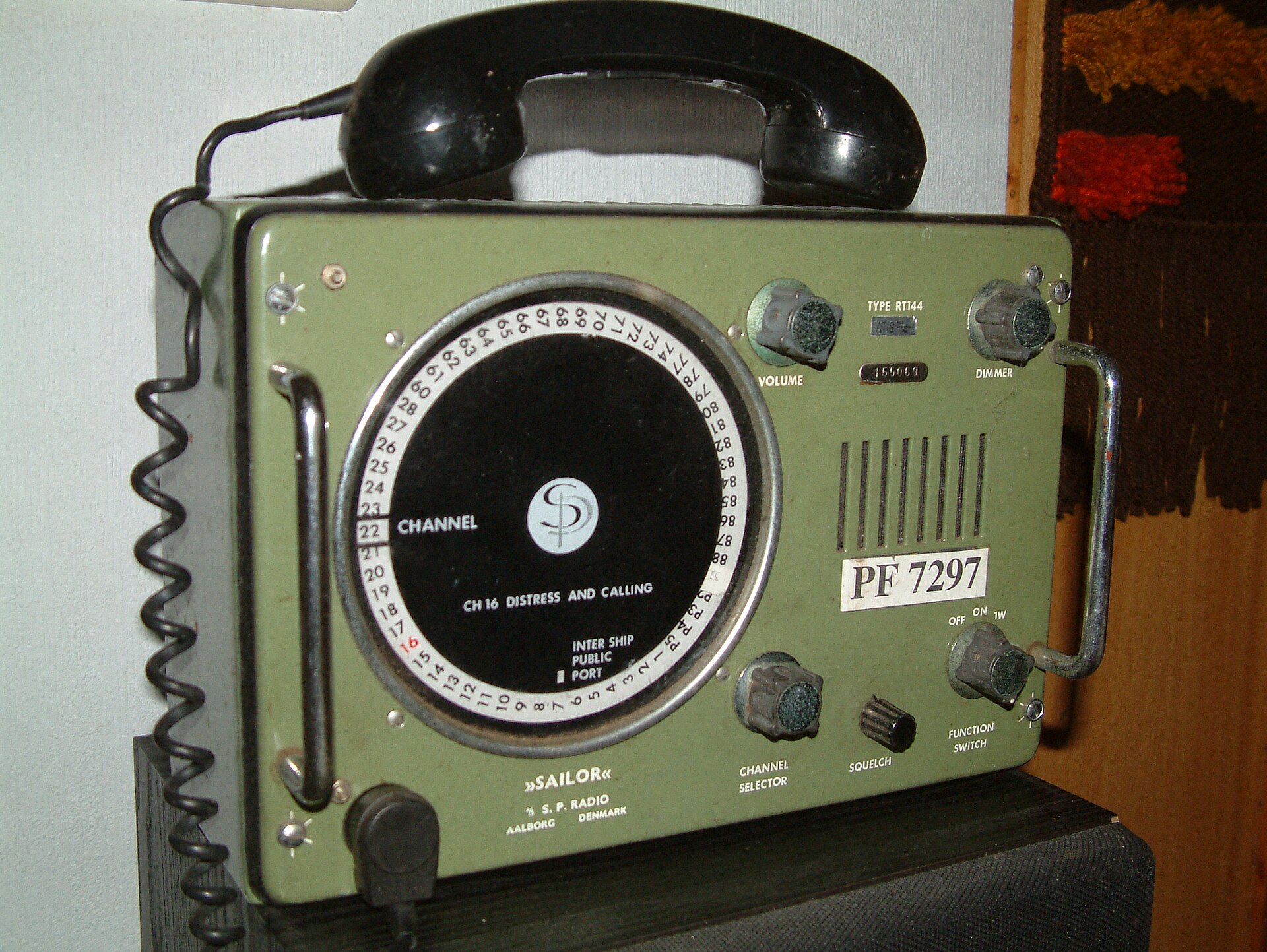 Sailor RT144 maritime VHF radio showing Channel 16 distress and calling frequency dial
