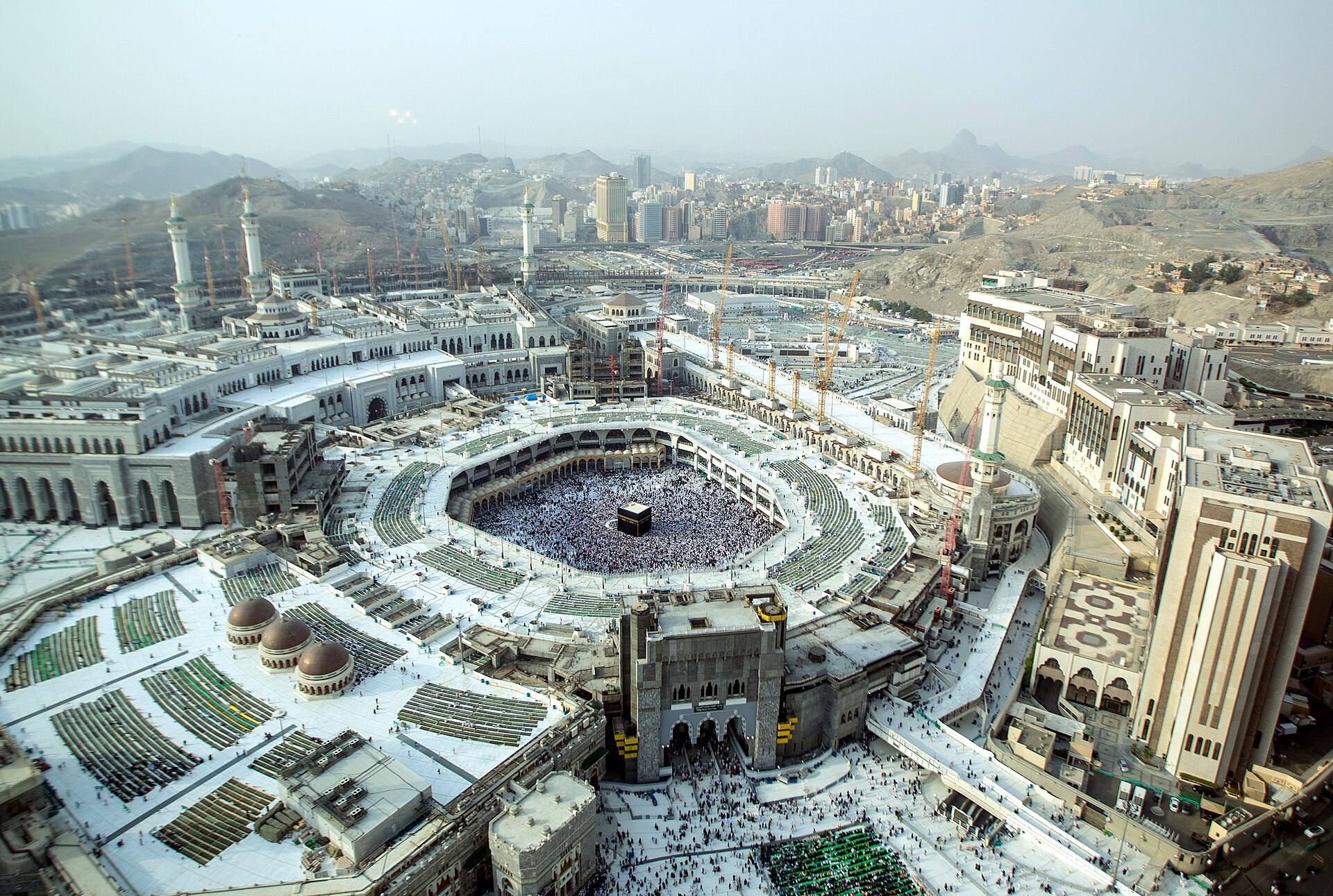 Aerial view of Masjid al-Haram, the Grand Mosque of Mecca, showing the Kaaba surrounded by tens of thousands of pilgrims during Hajj season