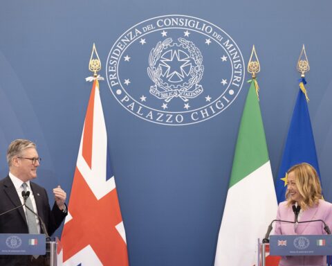 Italian Prime Minister Giorgia Meloni at a bilateral diplomatic meeting at Palazzo Chigi, Rome, with national flags
