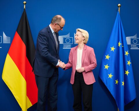 German Chancellor Friedrich Merz shakes hands with European Commission President Ursula von der Leyen at the European Commission headquarters, December 2025